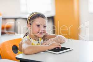 Little girl posing with tablet pc