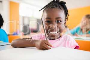Smiling portrait of a pupil studying
