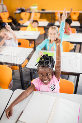 Pupils raising their hands