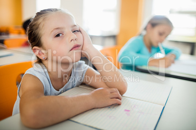 Bored little girl sitting