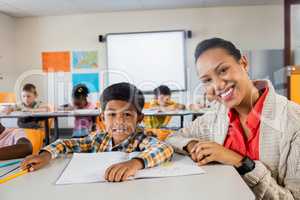 A teacher posing with boy