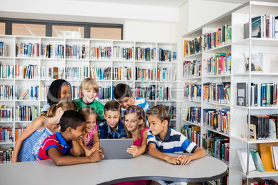 Front view of pupils using tablet pc