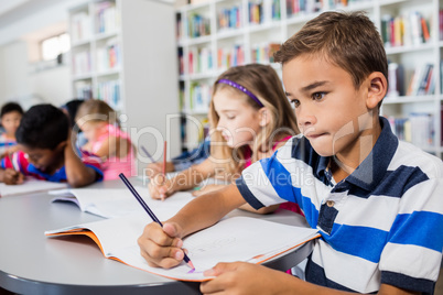 Side view of pupils drawing