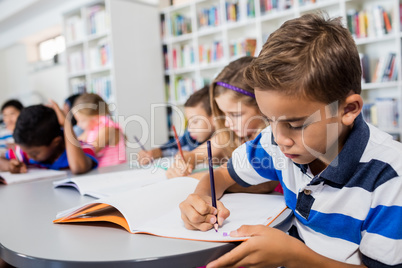 Side view of pupils drawing