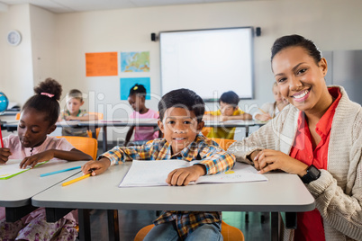 A happy teacher posing with a pupil