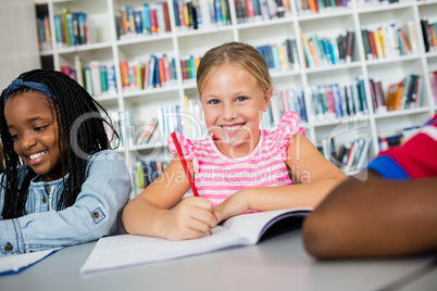 little girl posing at desk