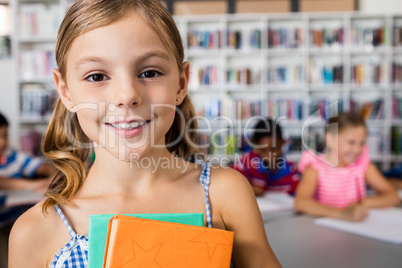 A cute little girl smiling at the camera