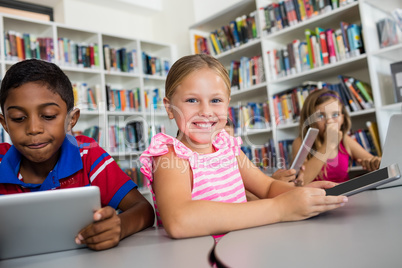 Portrait of smiling girl with tablet pc