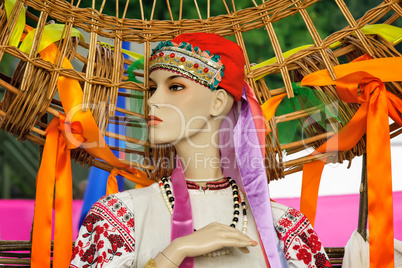 The ancient national dress and a hat on the dummy.