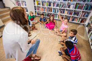 Teacher reading books to her students