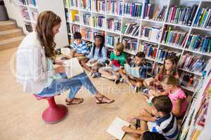 Teacher reading books to her students