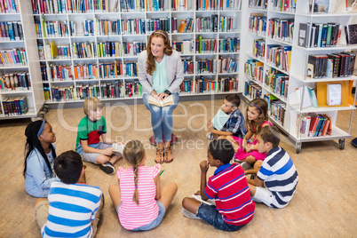 Teacher reading books to her students