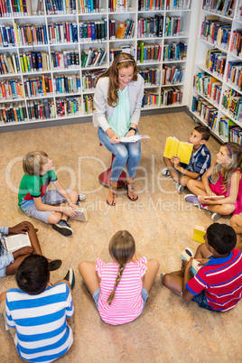 Teacher reading books to her students