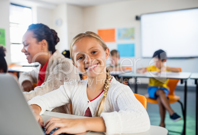 Child posing with her computer