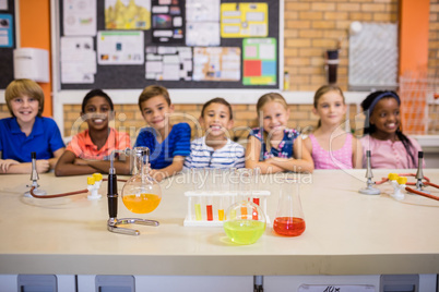 Students posing with chemical objects