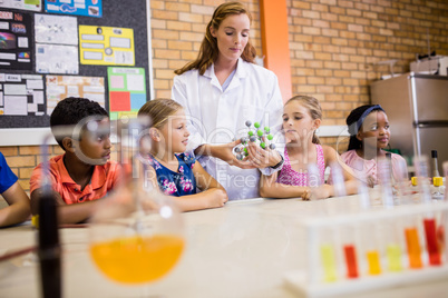 Teacher giving lesson to her students