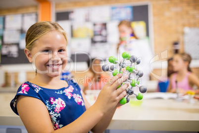 Child posing with an atom