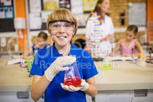 Child posing with a chemical liquid