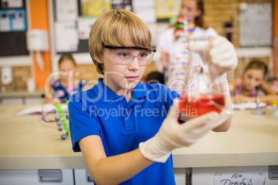 Child posing with a chemical liquid