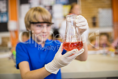 Child posing with a chemical liquid