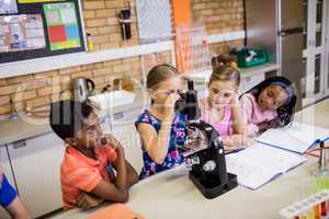 Children looking in microscope