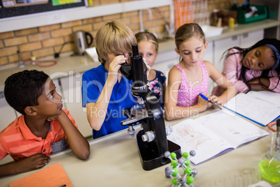 Children looking in microscope