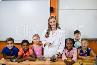Teacher posing with her students