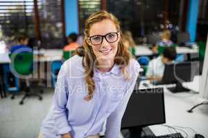 Teacher posing on her desk