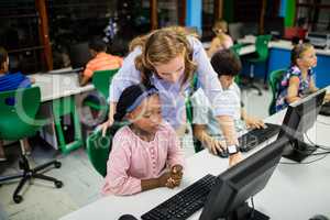 Teacher giving lesson to her students with technology