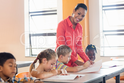 Teacher posing with her students