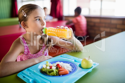 Child drinking at the canteen