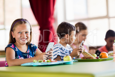 Children using technology during lunch