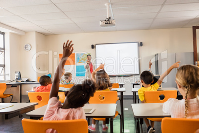 Teacher giving lesson to her students