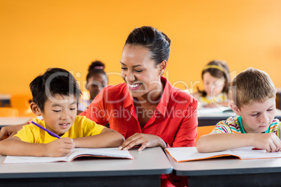 Teacher giving lesson to her students