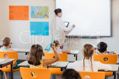 Teacher giving lesson to her students