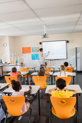 Teacher giving lesson to her students