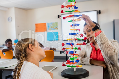 Teacher giving lesson to her students