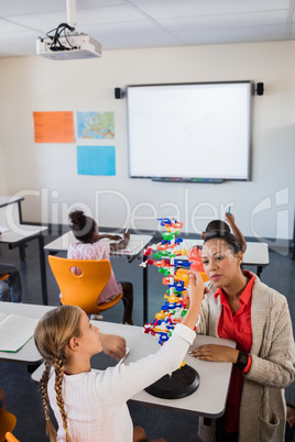 Teacher giving lesson to her students