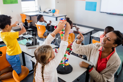 Teacher giving lesson to her students