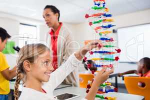 Child posing with her atoms creation