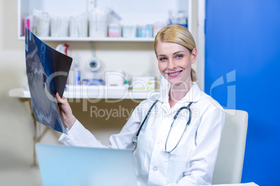 Portrait of woman vet bringing a x-ray