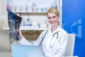 Portrait of woman vet bringing a x-ray