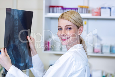 Portrait of woman vet bringing a x-ray