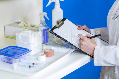 Close up of woman vet writing