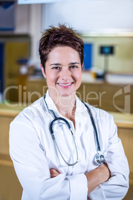 Portrait of woman vet smiling and crossed arms