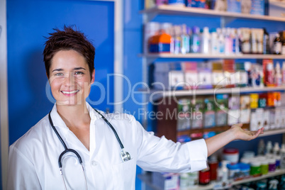 Smiling woman vet showing the medicine chest