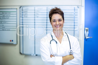 Woman vet smiling and posing with crossed arms