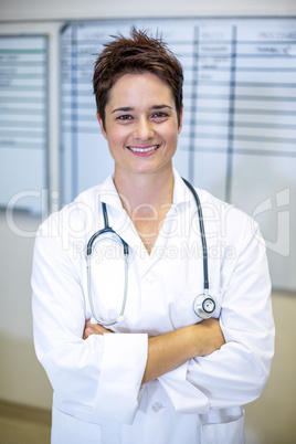 Portrait of woman vet smiling and posing with crossed arms