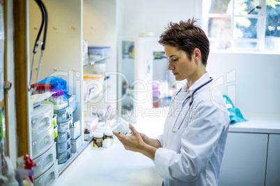 Woman vet preparing a syringe