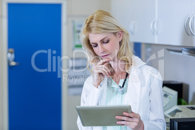 Portrait of woman vet studying a tablet